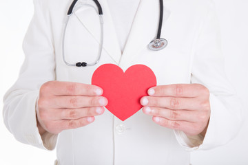 health care concept - doctor holding red paper heart isolated on