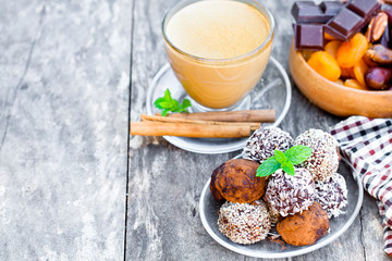 Assorted dark chocolate truffles with cocoa powder and coconut a