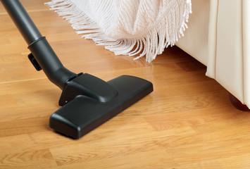 Living room with a vacuum cleaner