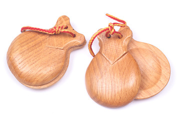 A pair of wooden spanish castanets isolated on white background