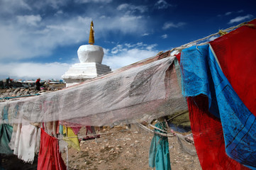 Prayer flags and buddhist stupa in the small village of Hor i Western Tibet