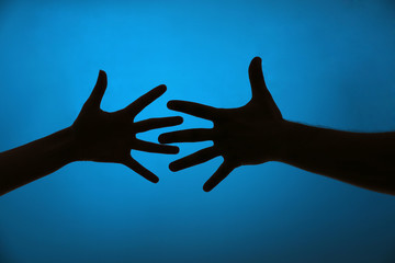 Silhouette of hands close up