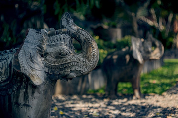 Beautiful statues of elephants on Bali island. Stone carving.