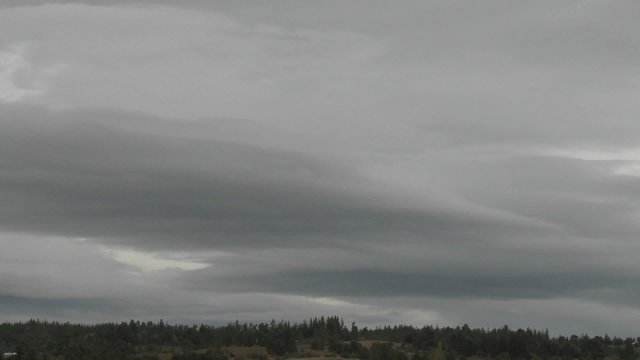 Dark rain clouds race across the sky near Talca, Chile.