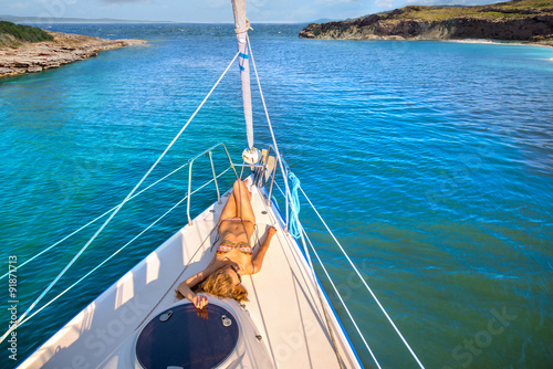 “Beautiful girl sunbathing on the yacht. " Stock photo and royalty-free