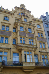 Fototapeta na wymiar yellow facade with balcony
