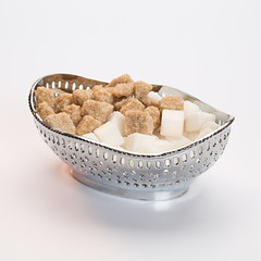 Metal sugar bowl with two kinds of sugar