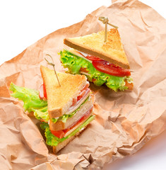 Two small canape sandwiches on kraft paper