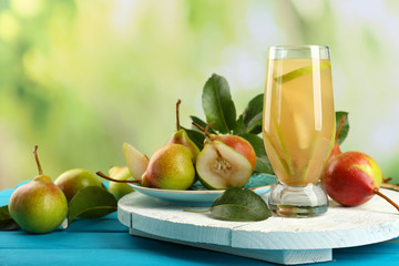 Fresh pear juice with fruit on bright background