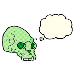 cartoon spooky skull with thought bubble