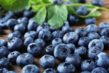 Fresh blueberries on wooden table, closeup