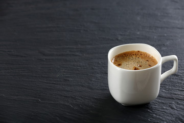 Cup of coffee on table close up