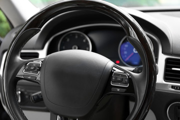 Modern car illuminated dashboard and steering wheel
