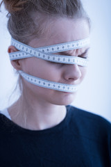 Female with tape-measure