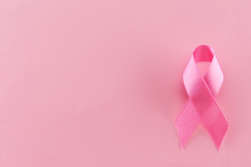 Satin ribbon sign on pink background