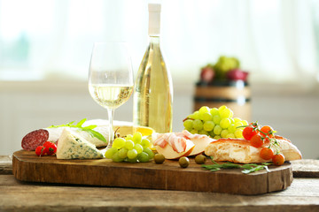 Still life with various types of Italian food and wine