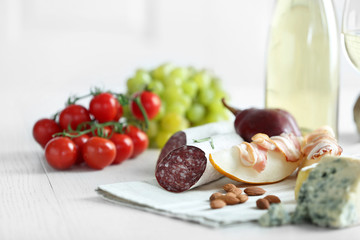 Still life with various types of Italian food and wine