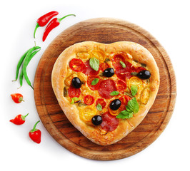 Heart shaped pizza on cutting board isolated on white