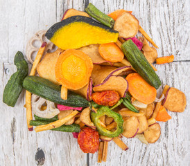 Mix vegetable chips over wooden background