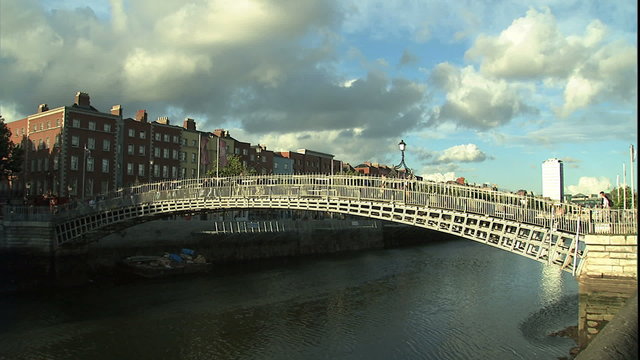 ws Dublin's river Lifey and pedestrian bridge with city in bg