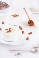 Homemade yogurt with honey and almonds.selective focus