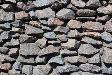 Old stone granite boulder wall texture background