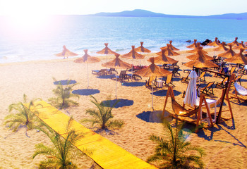 Sunny beach at bulgarian coastline resort - obrazy, fototapety, plakaty