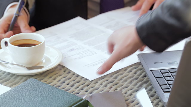 Signing a contract during a coffee break