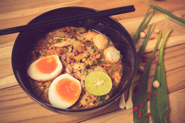 Thai noodle soup in a bowl taste spicy noodle soup and boiled eg