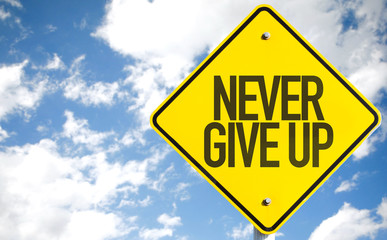 Never Give Up sign with sky background