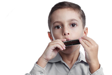 Child playing harmonica