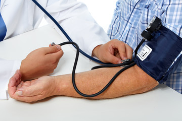 Doctor checking patient blood pressure.