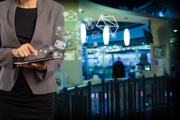 Business woman sending email by using digital tablet