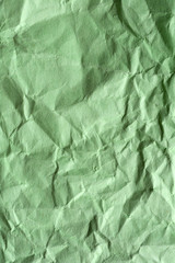 Green crumpled paper for background. Textured grunge surface for design.