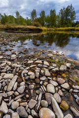 Pattern of rocks in river bed.