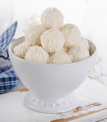 White chocolate candies in bowl.