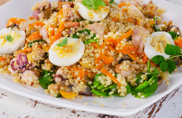 Mixed seafood salad with quinoa.
