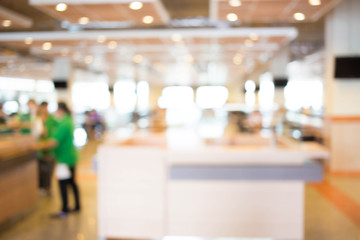 Coffee shop blur background with bokeh image .
