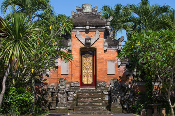 Fototapeta na wymiar Gate of Temple with ornaments. Indonesia, Bali, Ubud