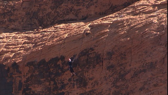 MWS as climber hanging on face