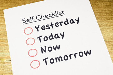 self checklist printed on paper and placed on wooden floor