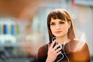 Woman calling phone in street