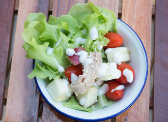 Fresh healthy salad in old cup