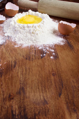 baking background  with raw egg and flour. Space for text