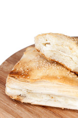 Puff pastry with cheese on the wooden board