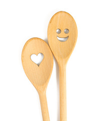 two spoons with heart and smile