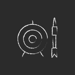 Target board and arrow icon drawn in chalk.