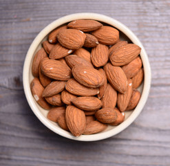 Almonds on wooden background