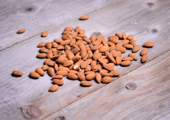 Almonds on wooden background