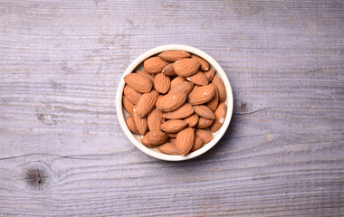 Almonds on wooden background